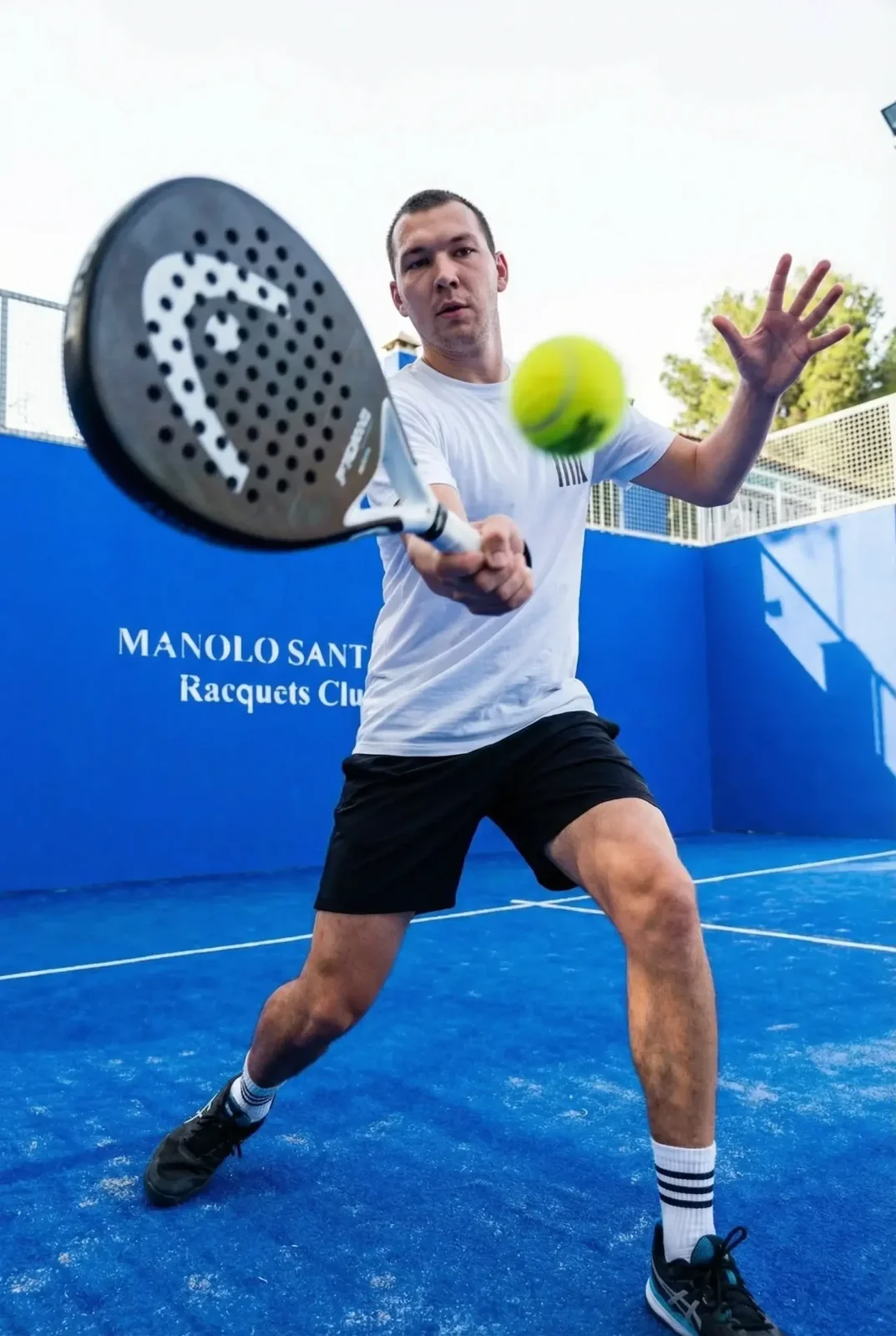 Player volleying with the ball in front of the racket
