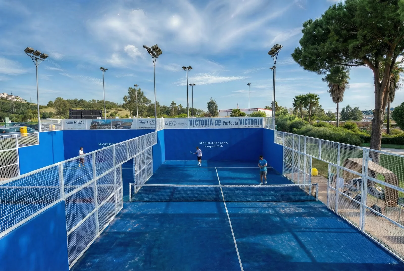 The club’s padel courts surrounded by pines and palm trees