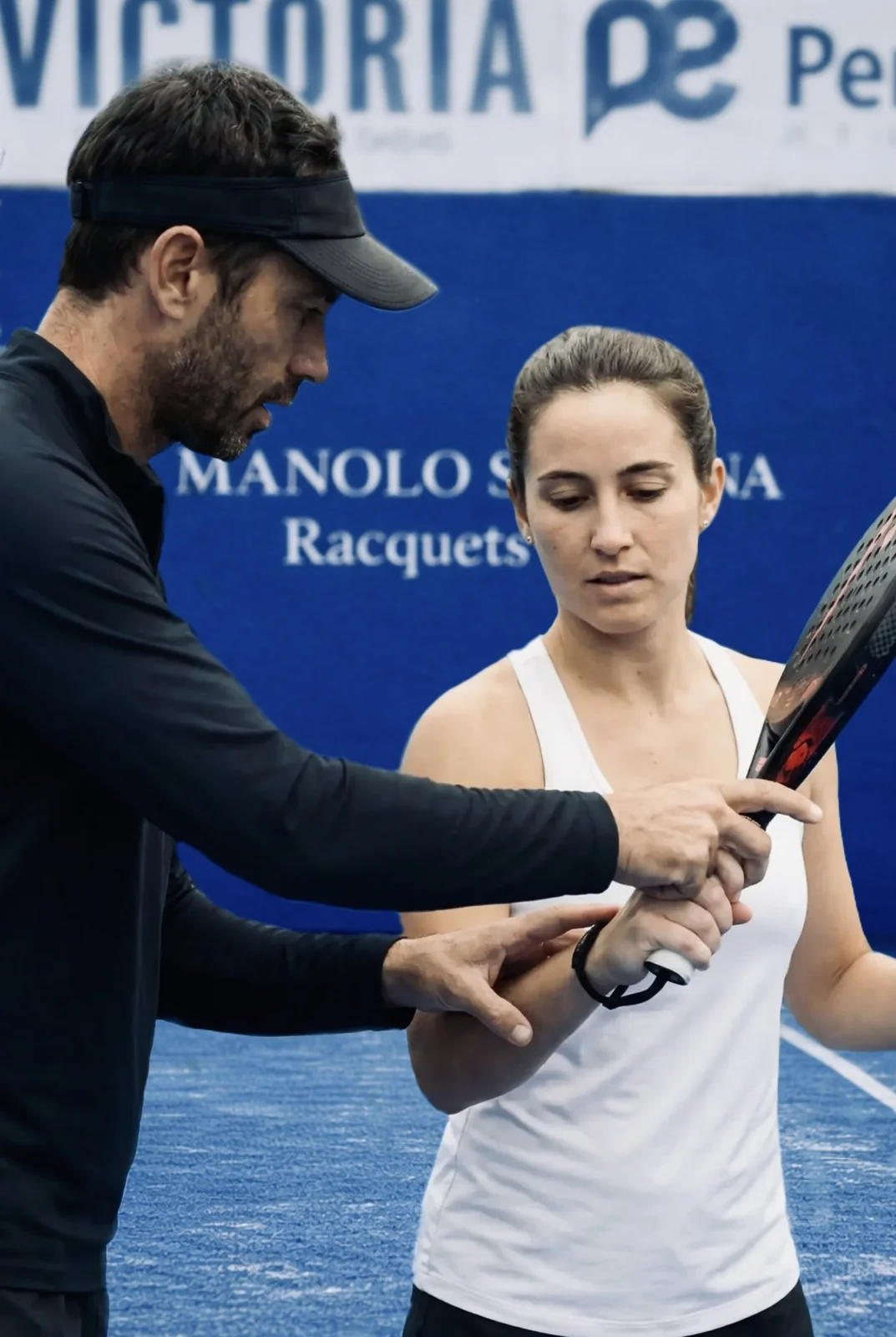 Coach correcting a pupil’s grip
